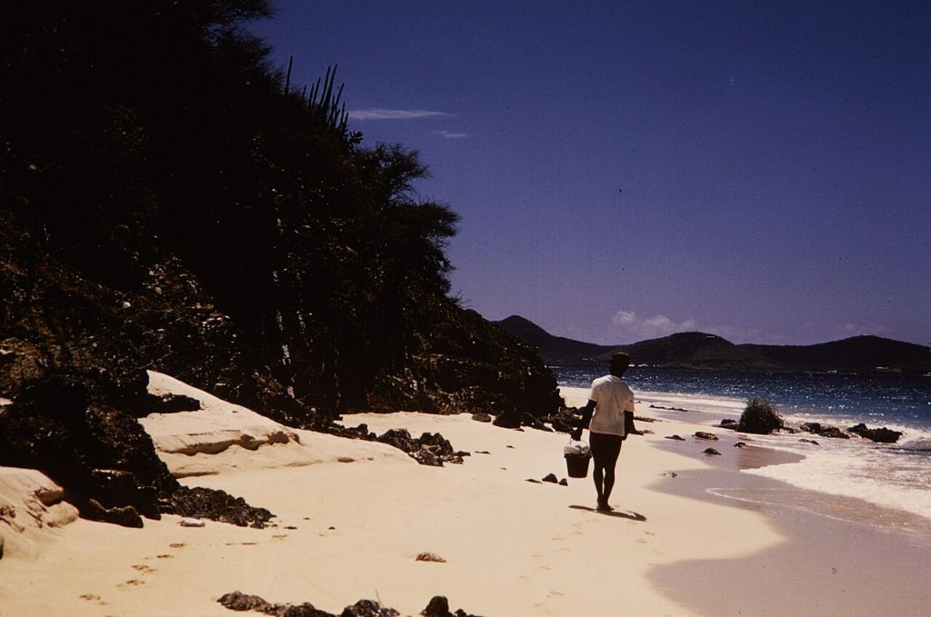 Visitor walking along a beach at Buck Island Reef National Monument near St. Croix